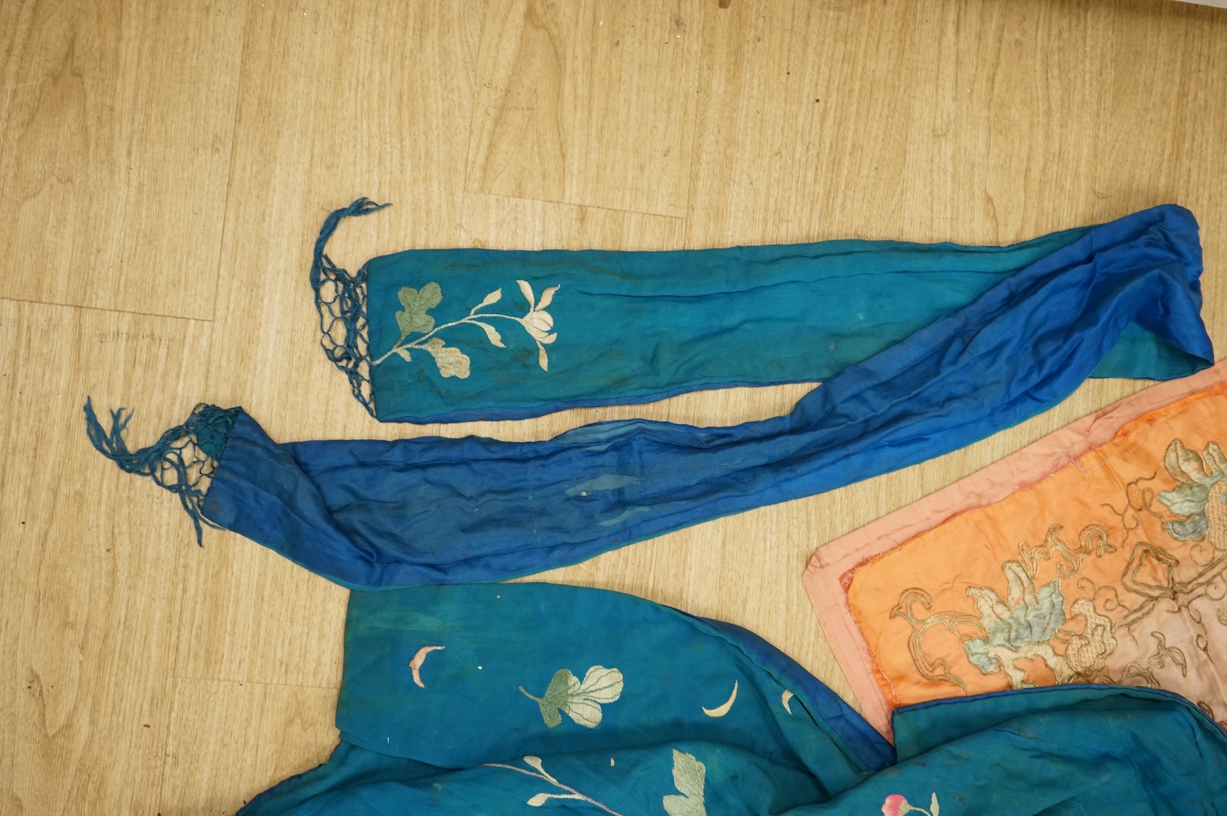 A collection of Chinese and Japanese embroidered kimonos and textiles